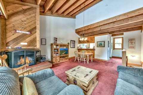 Living area, dining and kitchen with staircase to downstairs beds and baths.