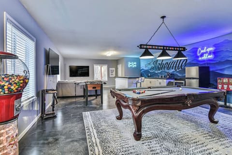 Billiards, Indoor Bar, Shuffleboard, Fooseball, life size connect 4, and two 75" HDTV's in one entertainment area