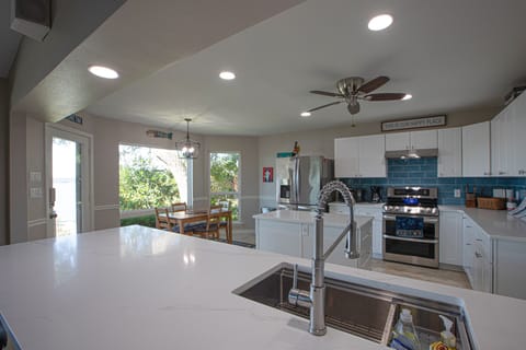 Quartz countertops and big fridge.