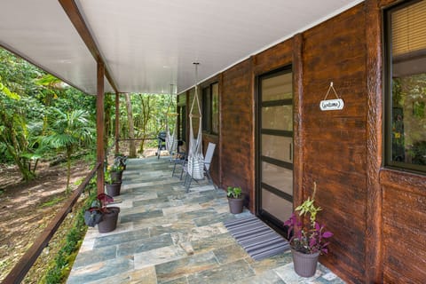 Huge, private covered porch! Perfect for morning coffee & tropical showers.