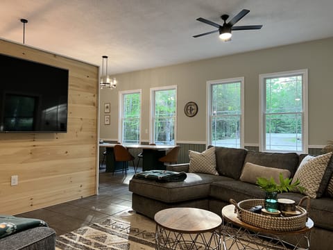 Living Area - 75" smart TV with (2) "L" sectionals and bar to seat 9 people