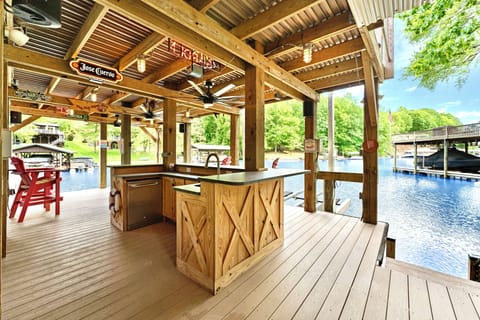 Oversized two story dock with deep water and guest slip available. Fridge/Sink!