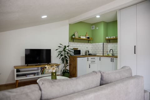 Air-conditioned open plan living room with a kitchen, sitting and dining areas