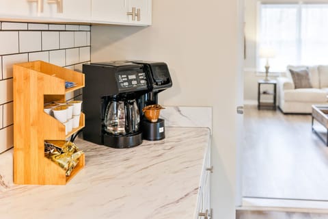 Keurig coffee pot with coffee and condiments