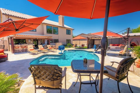 Heated Pool with plenty of seating and shading - lounge chairs and umbrellas