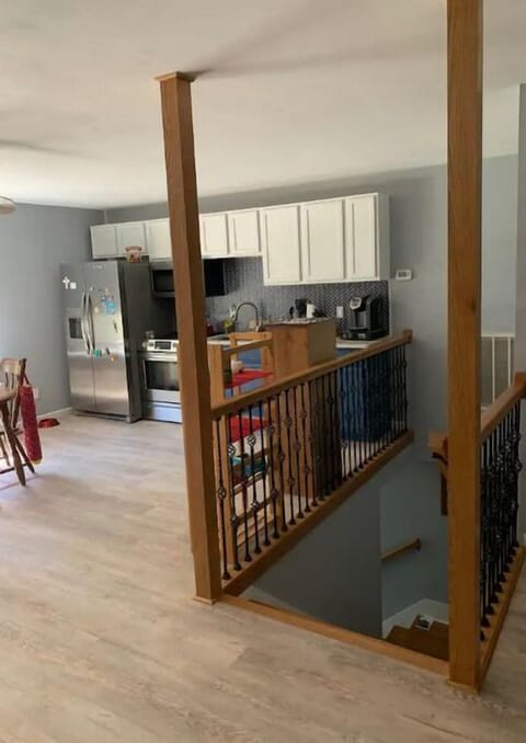 This is the stairwell w/Kitchen in the background.