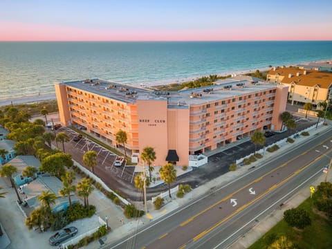 Reef Club bldg at sunset. You can't miss the coral color from the road or beach