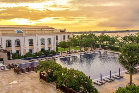 Outdoor pool, open 6:00 AM to 10:00 PM, pool umbrellas, sun loungers