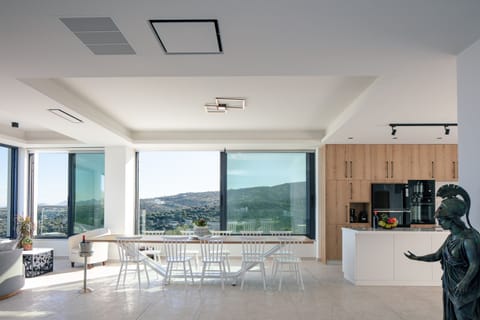 Indoor dining table for 10 guests, adjacent to the kitchen!