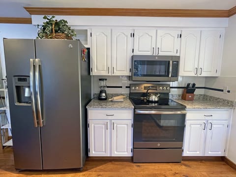 Refrigerator is side by Side with ice and water dispenser.