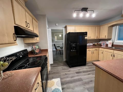 Kitchen w/ microwave, keurig, dishwasher, fridge w/ icemaker. Fully stocked.