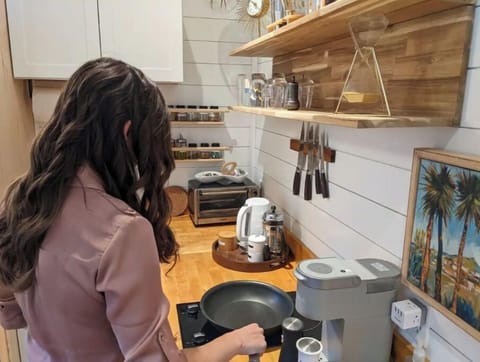 2 burner stove top, coffee maker, kettle, toaster oven, microwave, fridge