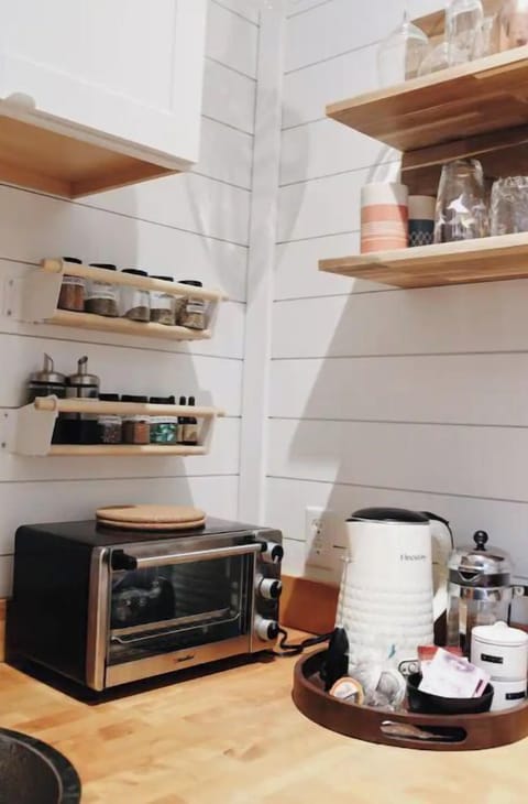 toaster oven, spices, kettle, coffee maker with coffee/tea provide