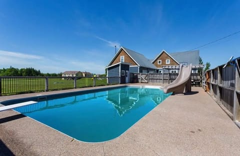 20x40 heated salt water pool, shallow & deep end with diving board & water slide