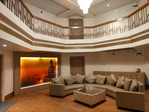 Family Quadruple Room | Living area | 42-inch LCD TV with digital channels, TV, pay movies