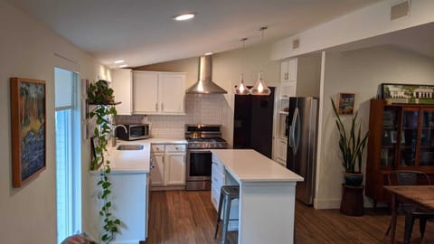 Full view of the kitchen with a peak of the the dining area 