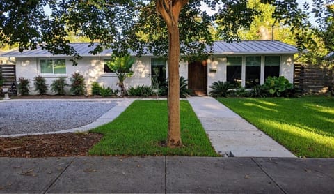 Front view of home that has a wonderful setting for rest and entertaining.
