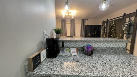 Fully stocked kitchen w/ microwave, coffee machine, & essential cooking utensils