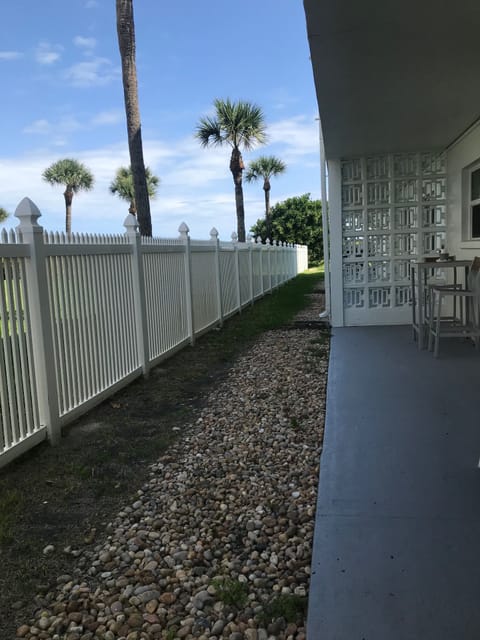 Private patio with seating. Path to beach & pool. 