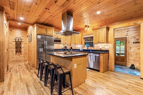 Bright and clean kitchen with island seating for four