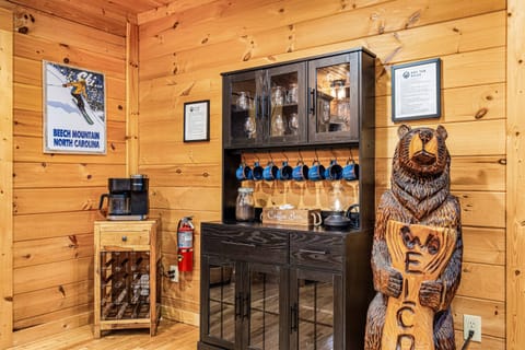 Fully stocked coffee bar with coffee grounds, k-cups, sugar, creamer and a variety of herbal teas.