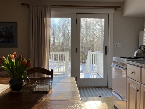 Afternoon sunlight brightens the cottage kitchen.
