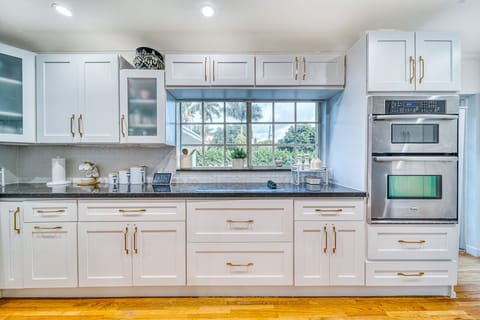 Kitchen overlooking backyard