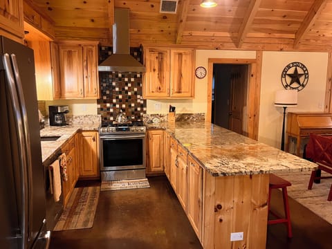 Modern and fully equipped kitchen with stainless appliances.