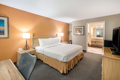 Desk, laptop workspace, iron/ironing board, travel crib