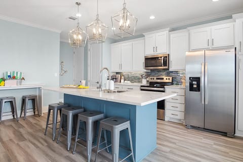 Beautiful modern kitchen with ample storage.
