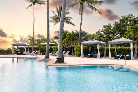 As the sun dips below the horizon, the enchanting cabanas embrace the whispers of evening tranquility, crafting a perfect retreat in paradise.