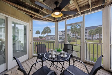 1st floor villa with amazing screen porch.  Walk right off the porch to the beach.