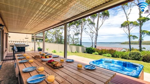 Alfresco dining area with gas BBQ and amazing views of lake 