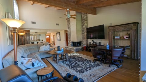 The living room is equipped with an 85" TV for movie night or the big game