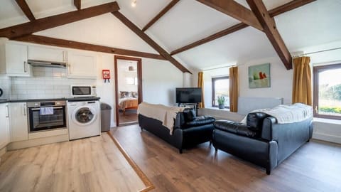 Soak in the character of our vaulted ceilings and original timber beams in this bright, open-plan living space designed for togetherness.