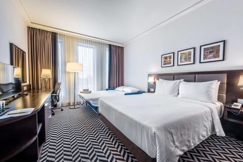 Family Room, 1 Queen Bed | Living area | 55-inch flat-screen TV with cable channels, TV