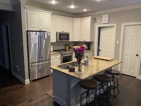 Granite countertops, wood floors throughout and new appliances