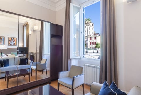 Deluxe Triple Room, City View | In-room safe, desk, soundproofing, iron/ironing board