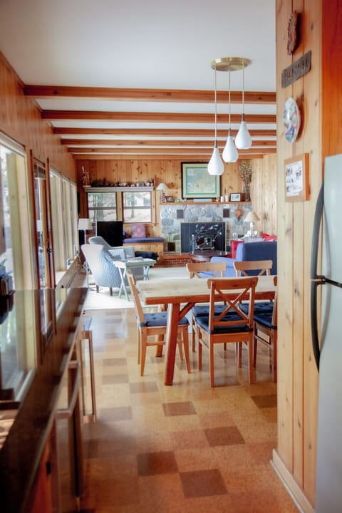 Just off the kitchen, the great room has space for conversation and family-style meals.