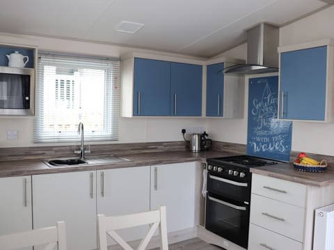 Fridge, electric kettle, toaster, cookware/dishes/utensils