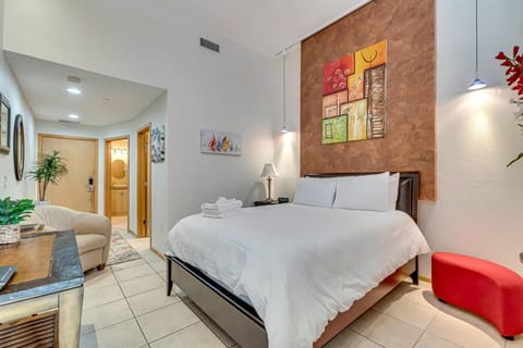 Unwind and recharge in our comfortable sleeping area, featuring a plush bed for a restful night's sleep and a Smart TV for entertainment.