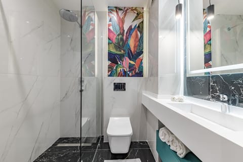 Shower, designer toiletries, hair dryer, bathrobes