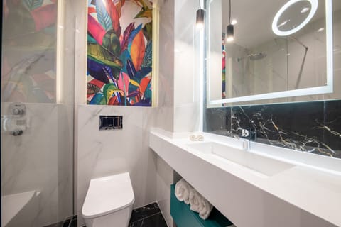 Shower, designer toiletries, hair dryer, bathrobes