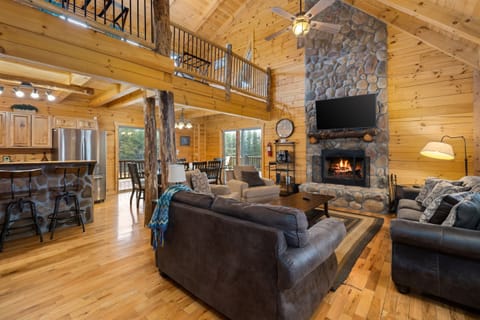 Open concept living, dining, and kitchen area are perfect for your big group.