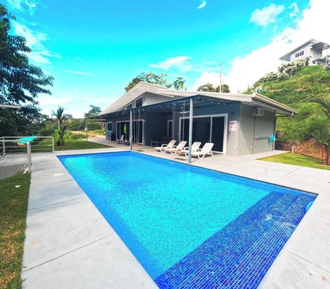 A beautiful house featuring a private pool, creating a serene oasis for relaxation.

