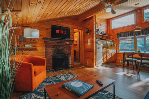 Honeymoon Cottage | Living area | 1-inch LCD TV with satellite channels, TV, DVD player