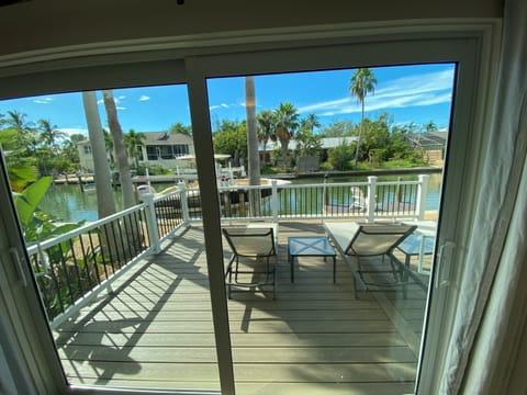 Master bedroom sliding glass door leads to back deck