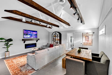 Large family room. 65" Smart TV and electronic fireplace