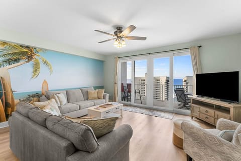 Living Room with fold out couch/Flat screen TV/sliding glass doors with view of ocean
