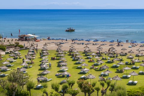 Private beach, beach umbrellas, beach volleyball